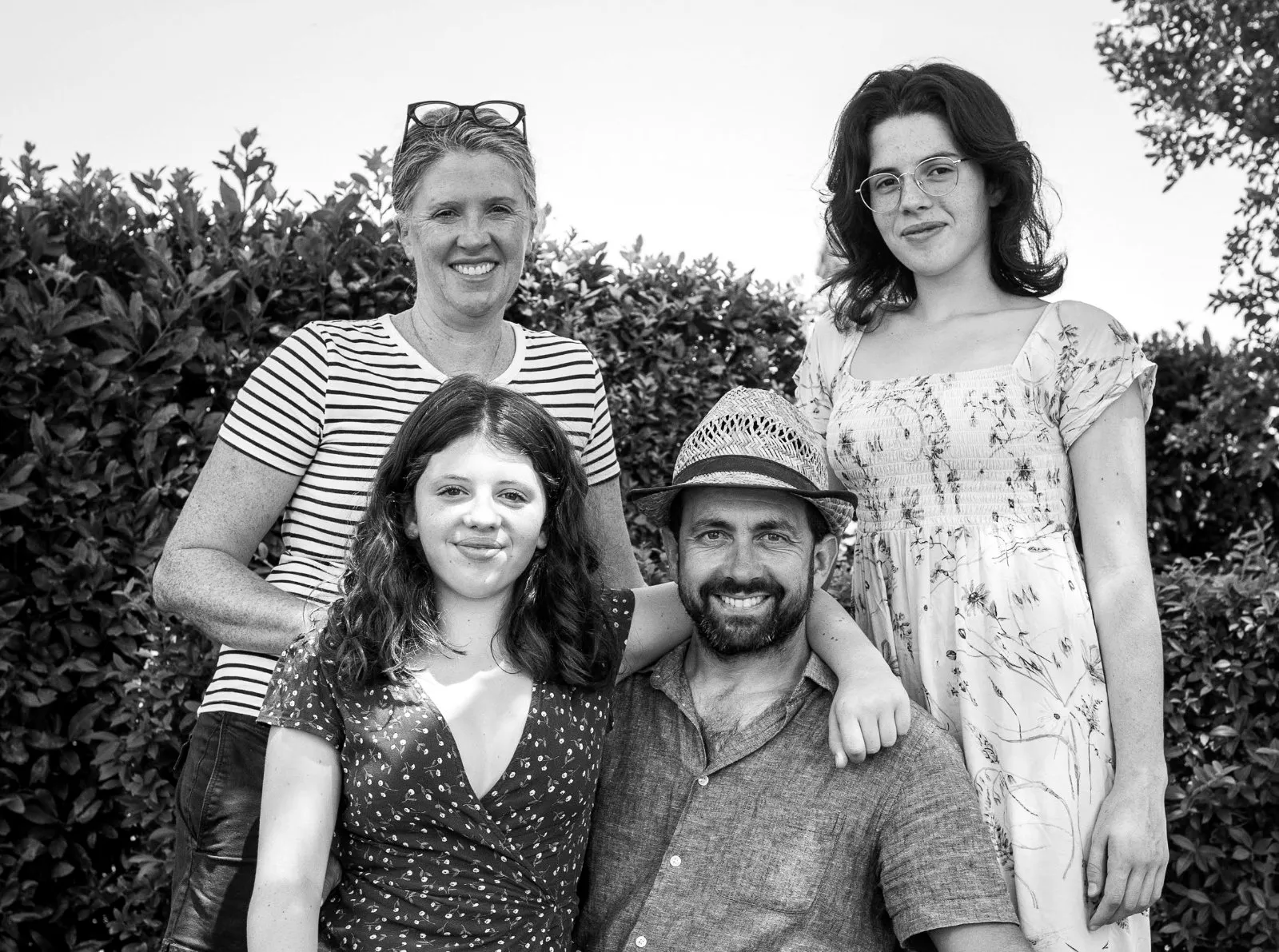 black and white of a smiley, happy cassetta's family