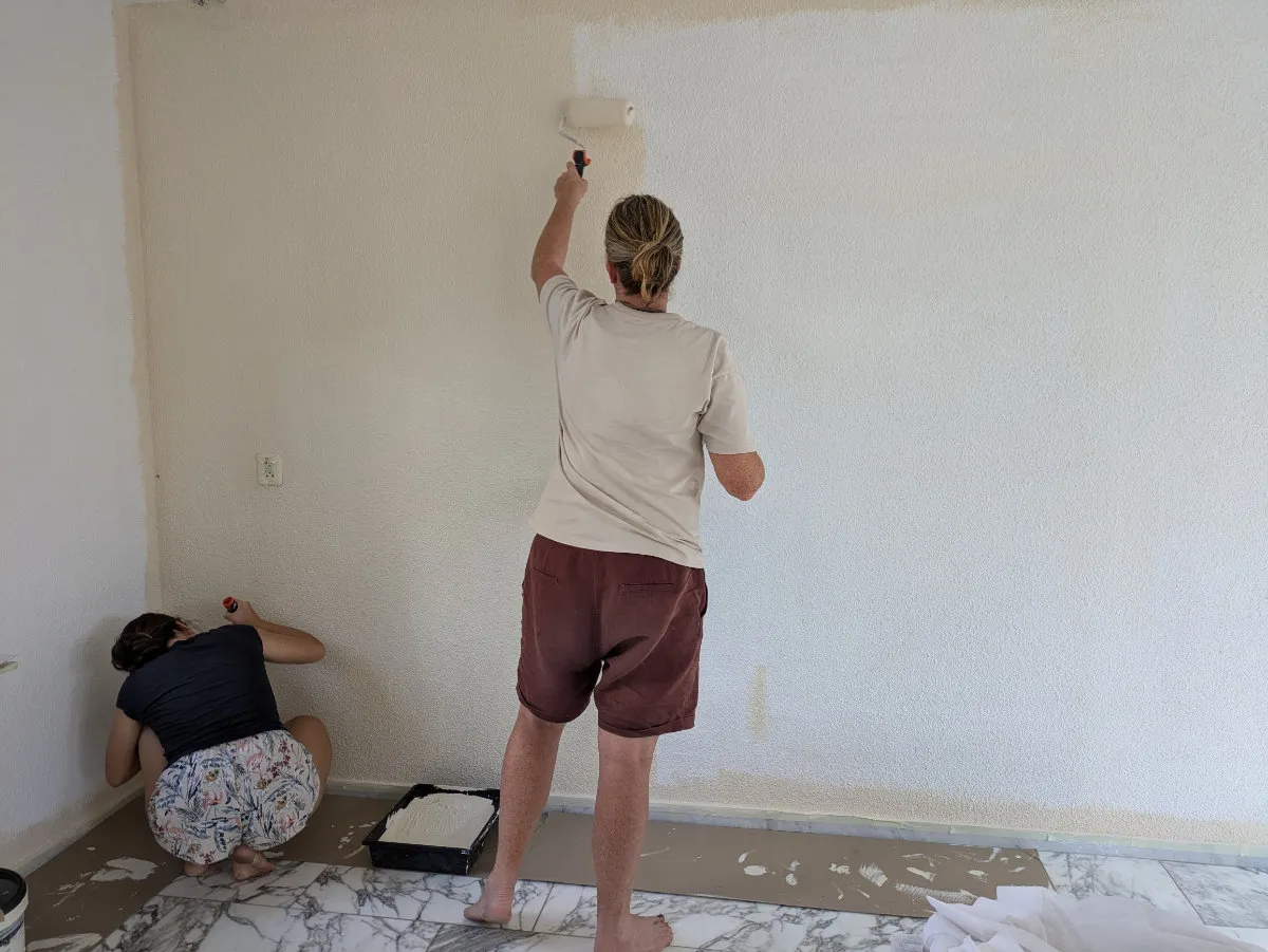 Hilly painting the living room