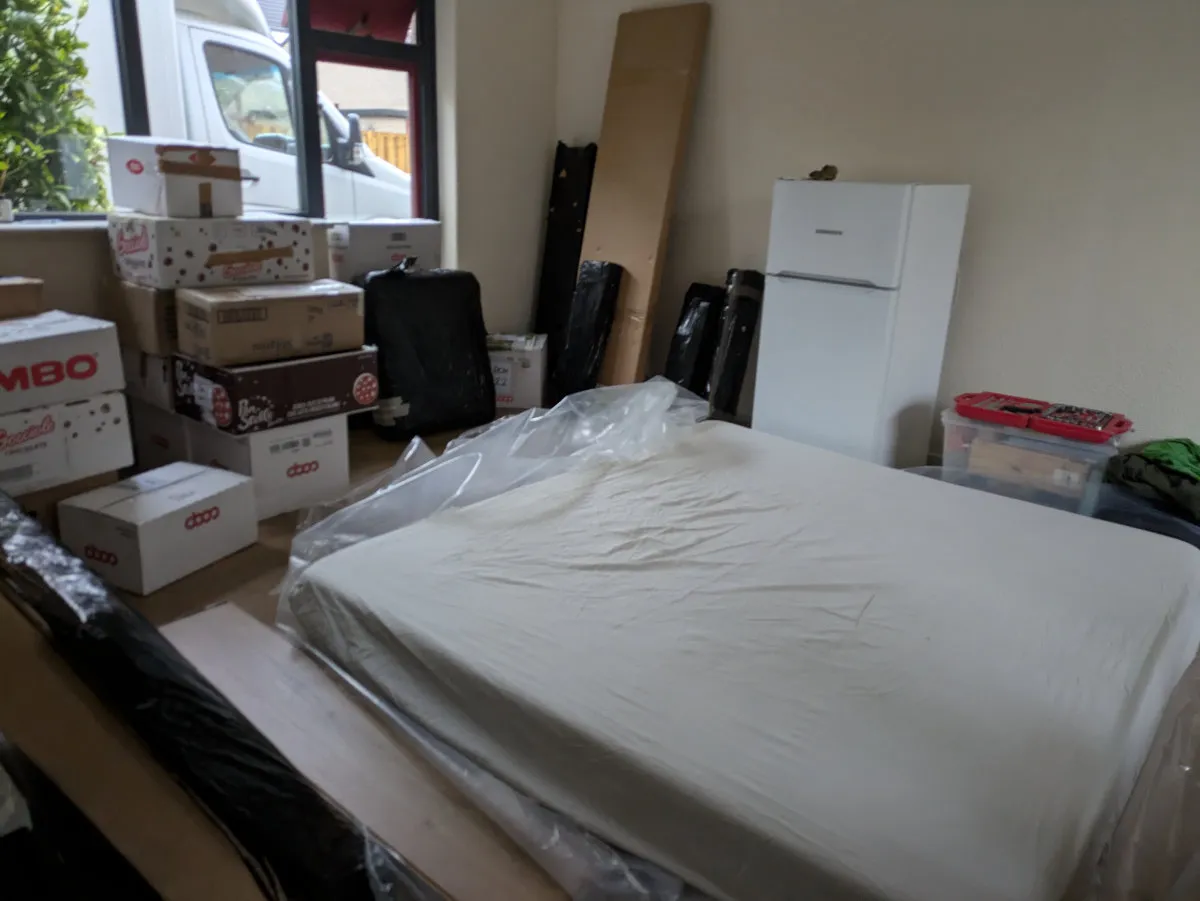 King size matress among the boxes
